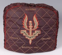 Lot 427 - A post WW II quilted tea cosy, having S.A.S...