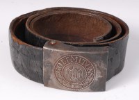 Lot 432 - A German Wehrmacht belt buckle on a brown...