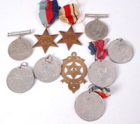 Lot 490 - A group of four WW II medals to include,...