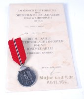 Lot 511 - A German Eastern front medal, with certificate...