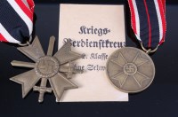 Lot 555 - A German War Merit Cross with swords, together...