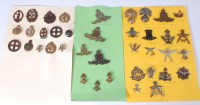 Lot 562 - A collection of assorted cap badges and...