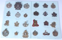 Lot 565 - A collection of assorted cap badges and...