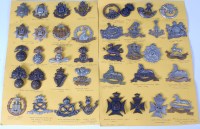 Lot 566 - A collection of assorted cap badges of various...