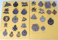 Lot 568 - A collection of assorted cap badges of various...