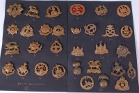 Lot 570 - A collection of assorted cap badges of various...