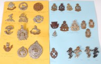 Lot 574 - A collection of assorted cap badges and...