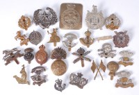 Lot 576 - A collection of assorted cap badges and...