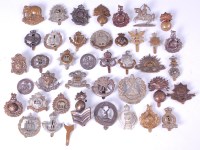 Lot 577 - A large collection of assorted cap badges and...