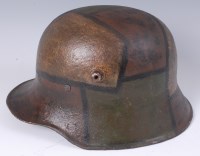 Lot 456 - A German M16 steel helmet with camouflage...