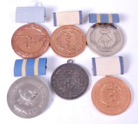 Lot 473 - A collection of six East German medals to...