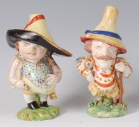 Lot 1045 - A pair of early 19th century pearlware figures...