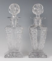 Lot 1068 - A pair of late Victorian heavy glass decanters...