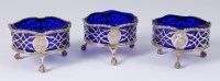 Lot 1104 - A set of three early George III silver table...