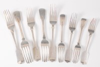 Lot 1124 - A harlequin set of ten silver table forks, in...