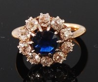 Lot 1139 - An 18ct gold, sapphire and diamond cluster...