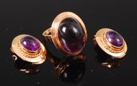 Lot 1170 - An 18ct gold and cabochon amethyst set dress...