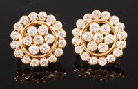 Lot 1171 - A pair of yellow metal and diamond cluster ear...