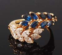 Lot 1176 - An 18ct gold, sapphire and diamond cocktail...