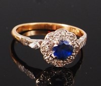 Lot 1178 - An 18ct gold, sapphire and diamond cluster...