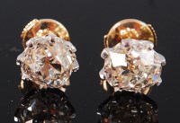 Lot 1186 - A pair of 18ct gold diamond ear studs, the...