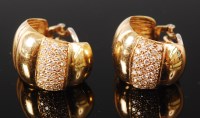 Lot 1189 - A pair of 18ct gold and diamond set ear clips,...