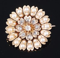 Lot 1205 - A 22ct gold, diamond and seed pearl set flower...