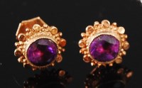 Lot 1207 - A pair of 9ct gold amethyst set ear studs, the...