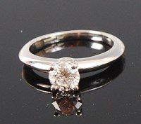 Lot 1216 - A modern platinum and diamond solitaire ring,...