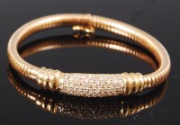 Lot 1223 - A modern yellow metal diamond set bracelet,...