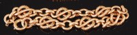 Lot 1232 - A 9ct gold fancylink bracelet, with safety...