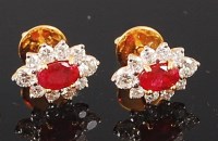 Lot 1238 - A pair of yellow metal, ruby and diamond set...