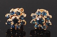 Lot 1239 - A pair of 9ct gold and sapphire set ear studs,...