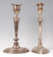 Lot 1113 - A pair of silver table candlesticks in the...