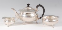 Lot 1125 - A George V silver three piece tea set,...