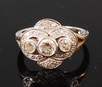 Lot 1140 - An 18ct white gold and diamond dress ring, the...