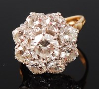 Lot 1156 - An 18ct gold diamond flower head cluster ring,...