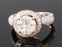 Lot 1281 - An 18ct white gold diamond cluster ring, the...