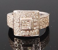 Lot 1282 - An Art Deco platinum and diamond set dress...