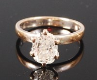 Lot 1283 - An 18ct white gold diamond solitaire ring, the...