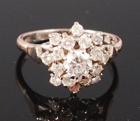 Lot 1284 - An 18ct white gold and diamond cluster ring,...