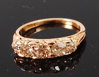 Lot 1286 - An 18ct gold and diamond five stone ring, the...