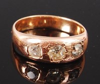 Lot 1290 - A gents 9ct gold and diamond three stone gypsy...