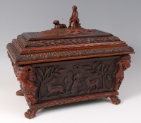 Lot 1332 - A Victorian carved walnut tea caddy, of carved...