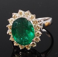 Lot 1244 - A contemporary 14ct white gold, emerald and...