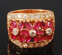 Lot 1245 - An 18ct gold, ruby and diamond set dress ring,...