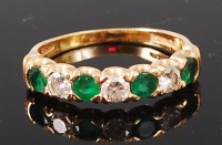 Lot 1258 - A modern 18ct gold, emerald and diamond set...