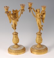 Lot 1365 - A pair of French Empire gilt bronze candelabra,...