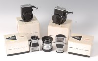 Lot 1381 - Four boxed Leitz Leica camera accessories, to...