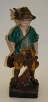 Lot 11 - A mid-20th century painted plaster figure of a...